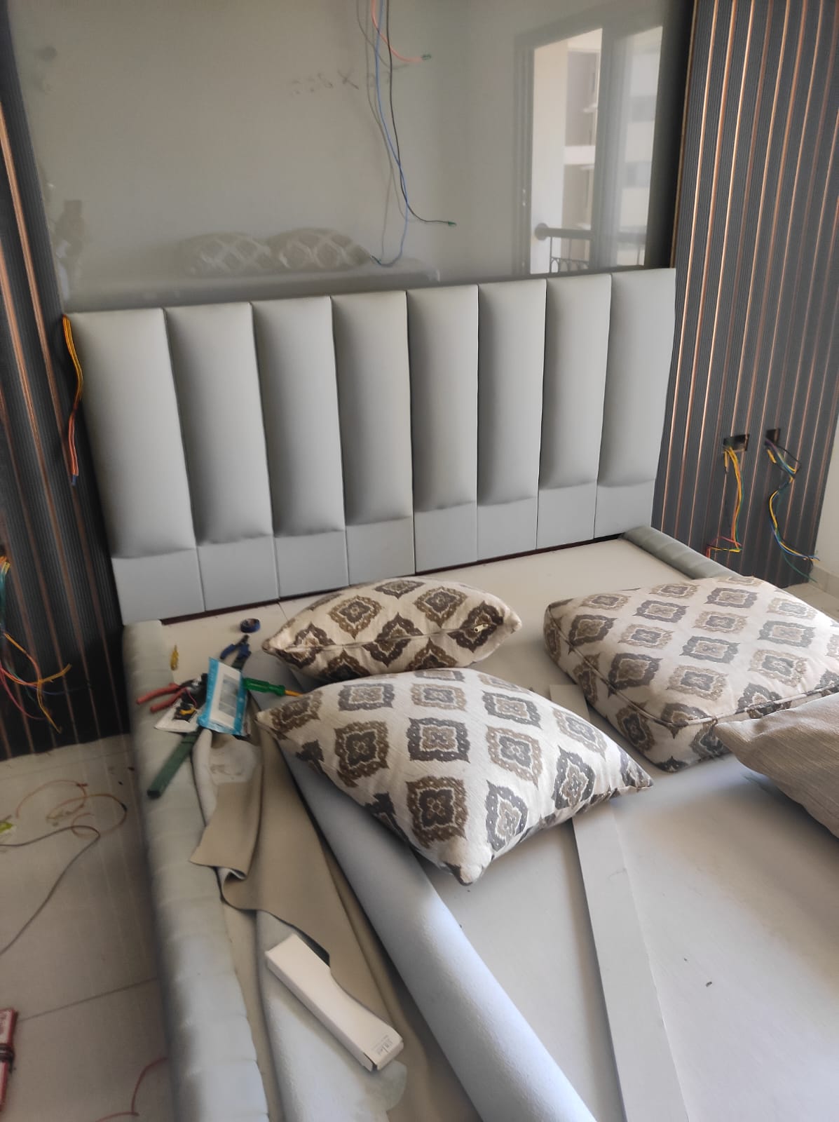 Deep cleaning a sofa with a handheld brush cleaner