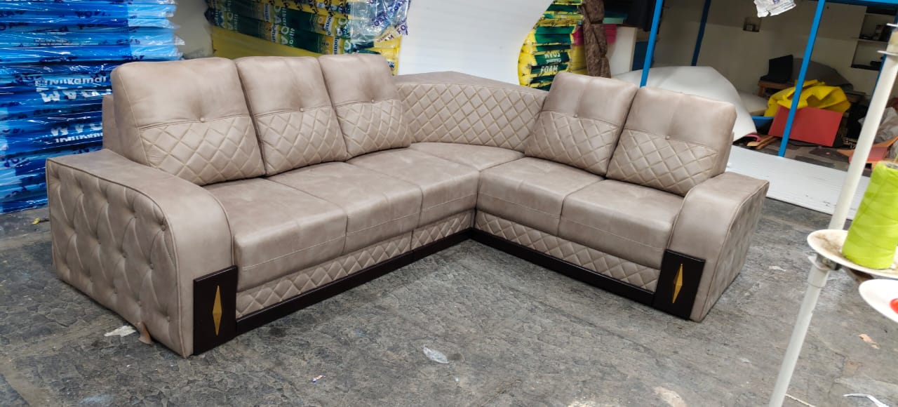 Deep cleaning a sofa with a handheld brush cleaner
