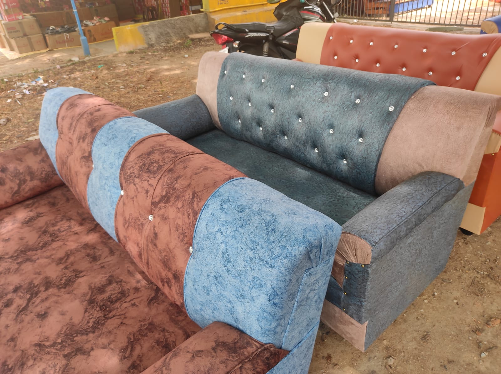 Deep cleaning a sofa with a handheld brush cleaner